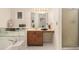 Bathroom with large jacuzzi tub, vanity, mirrors, overhead lighting, and glass door shower at 1272 Whitlock Ridge Drive Sw Dr, Marietta, GA 30064