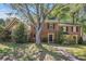 Charming brick two-story home with a beautiful front yard, mature tree, and inviting entrance at 1272 Whitlock Ridge Drive Sw Dr, Marietta, GA 30064