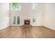 Spacious living room featuring a fireplace, wood floors, tall ceiling and French doors at 1272 Whitlock Ridge Drive Sw Dr, Marietta, GA 30064
