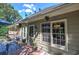 Charming home exterior featuring a cozy back deck with seating and dining areas at 263 Bennett Farms Trl, Acworth, GA 30102
