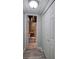 A basement hallway leading to a bathroom, showcasing a laundry chute and storage at 263 Bennett Farms Trl, Acworth, GA 30102
