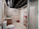 Cozy bathroom featuring tile floors, shower, vanity, and unique exposed ceiling pipes at 263 Bennett Farms Trl, Acworth, GA 30102