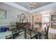 A dining room area featuring a chandelier, dark wood floors and furnishings at 263 Bennett Farms Trl, Acworth, GA 30102