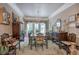 A large dining room area featuring a chandelier, dark wood floors and furnishings at 263 Bennett Farms Trl, Acworth, GA 30102
