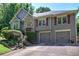Charming two-story home featuring a two-car garage, stone accents, and well-manicured landscaping at 263 Bennett Farms Trl, Acworth, GA 30102