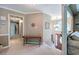 Bright hallway with carpet, neutral paint, and views of the staircase and living area at 263 Bennett Farms Trl, Acworth, GA 30102