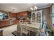 A kitchen with a dining area, including wooden cabinets and a view of backyard at 263 Bennett Farms Trl, Acworth, GA 30102