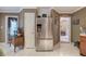 A stainless steel refrigerator is the focal point of this kitchen with white tile floors at 263 Bennett Farms Trl, Acworth, GA 30102