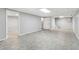 Large basement area featuring tile flooring and access to additional rooms through doorways at 3902 Robin Court Ct, Acworth, GA 30101