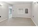Basement showcasing neutral walls, carpet, built in shelving, and an open doorway at 3902 Robin Court Ct, Acworth, GA 30101