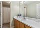 Well-lit bathroom featuring a long countertop, white sink, and a shower with a white curtain at 3902 Robin Court Ct, Acworth, GA 30101
