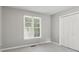 Bright bedroom with a large window offering natural light and a spacious closet at 3902 Robin Court Ct, Acworth, GA 30101