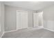 Neutral bedroom with carpet flooring and a closet with double doors, offering ample storage at 3902 Robin Court Ct, Acworth, GA 30101