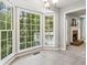 Bright breakfast nook with large windows offering a view of the surrounding greenery and access to the outdoor deck at 3902 Robin Court Ct, Acworth, GA 30101
