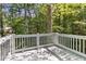 Outdoor deck surrounded by lush trees, providing a serene and private retreat at 3902 Robin Court Ct, Acworth, GA 30101
