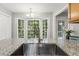 Spacious kitchen featuring granite countertops, a stainless steel sink, and bright natural lighting at 3902 Robin Court Ct, Acworth, GA 30101