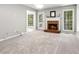 Inviting living room with a cozy brick fireplace, and plenty of natural light at 3902 Robin Court Ct, Acworth, GA 30101