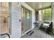 Inviting screened porch with neutral door, home sweet home doormat, and a cozy seating area at 3902 Robin Court Ct, Acworth, GA 30101