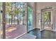 Large sliding glass doors open to a spacious wood deck offering beautiful backyard and lake views at 504 Telfair Park, Peachtree City, GA 30269