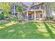 Spacious backyard featuring multi-level decks, a lush lawn, and outdoor seating areas at 504 Telfair Park, Peachtree City, GA 30269