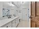 Stylish bathroom with white cabinets, marble countertop, and a shark themed shower curtain at 504 Telfair Park, Peachtree City, GA 30269