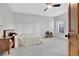 Cozy bedroom with light grey carpet, a ceiling fan, and a comfortable bed by the window at 504 Telfair Park, Peachtree City, GA 30269
