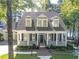 Beautiful home with a covered front porch, classic architectural details, and views of the waterfront at 504 Telfair Park, Peachtree City, GA 30269