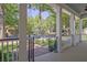 View from the covered front porch showcasing the landscaped front yard and surrounding community at 504 Telfair Park, Peachtree City, GA 30269