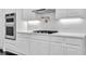 Kitchen featuring white cabinets, granite countertops, stainless steel appliances, and a gas cooktop at 504 Telfair Park, Peachtree City, GA 30269