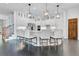 Kitchen with white cabinets, stainless steel appliances, quartz counters and a large island at 504 Telfair Park, Peachtree City, GA 30269