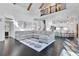 Open concept living room with hardwood floors, fireplace and a staircase with wood and iron railings at 504 Telfair Park, Peachtree City, GA 30269
