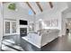 Vaulted ceiling living room with fireplace, large windows, and doors offers plenty of natural light at 504 Telfair Park, Peachtree City, GA 30269