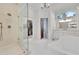 Well-lit main bathroom with walk-in closet, a standalone tub, and a marble vanity at 504 Telfair Park, Peachtree City, GA 30269