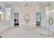 Elegant main bathroom featuring a soaking tub, separate vanities, and glass shower at 504 Telfair Park, Peachtree City, GA 30269