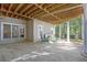 Covered patio with exposed wood ceiling beams and cozy seating area for relaxation at 504 Telfair Park, Peachtree City, GA 30269