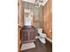 Elegant powder room featuring a custom wood vanity and unique wall coverings at 504 Telfair Park, Peachtree City, GA 30269