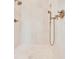 Close up of a modern walk-in shower featuring sleek fixtures and marble tiles at 504 Telfair Park, Peachtree City, GA 30269