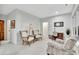 Bright sitting area with comfortable chairs and a desk near the window at 504 Telfair Park, Peachtree City, GA 30269