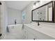 Bright modern bathroom with freestanding tub, double vanity, and separate glass enclosed shower at 5870 Shadewater Dr. Dr, Cumming, GA 30041