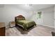 Neutral bedroom features hardwood floors and a convenient exterior door at 5870 Shadewater Dr. Dr, Cumming, GA 30041