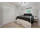 Bright bedroom features a white bed frame, double door closet, and neutral wall paint at 5870 Shadewater Dr. Dr, Cumming, GA 30041