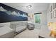 Bedroom with whimsical mural, rocking chair, and ample space for a growing Gathering at 5870 Shadewater Dr. Dr, Cumming, GA 30041