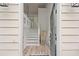 Welcoming entryway with hardwood floors and a staircase leading to the upper level at 5870 Shadewater Dr. Dr, Cumming, GA 30041