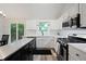 Modern kitchen featuring stainless steel appliances, bright white cabinets, and a center island at 5870 Shadewater Dr. Dr, Cumming, GA 30041
