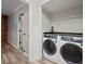 Laundry room complete with washer and dryer at 5870 Shadewater Dr. Dr, Cumming, GA 30041