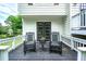 Inviting outdoor patio with rocking chairs, perfect for relaxing and enjoying the serene surroundings at 5870 Shadewater Dr. Dr, Cumming, GA 30041