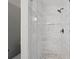 Modern shower with glass enclosure and decorative tile accent at 5870 Shadewater Dr. Dr, Cumming, GA 30041