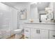 Clean bathroom with a shower and tub combo, modern fixtures, and neutral tones at 911 Oakland Sw Dr, Atlanta, GA 30310