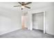 Bright bedroom featuring neutral decor and carpet, with a large closet for storage at 911 Oakland Sw Dr, Atlanta, GA 30310