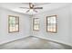 Cozy carpeted bedroom featuring bright windows and neutral paint at 911 Oakland Sw Dr, Atlanta, GA 30310